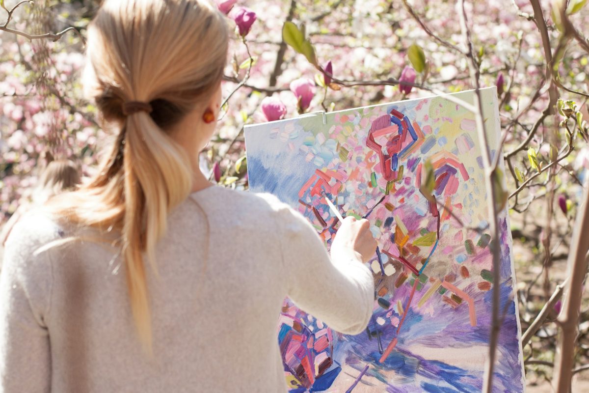 person painting with others in art therapy setting.jpg