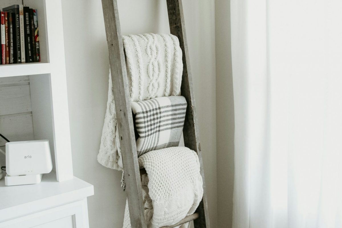 rustic wooden ladder mounted on bathroom wall holding towels, cozy decor 2.jpg