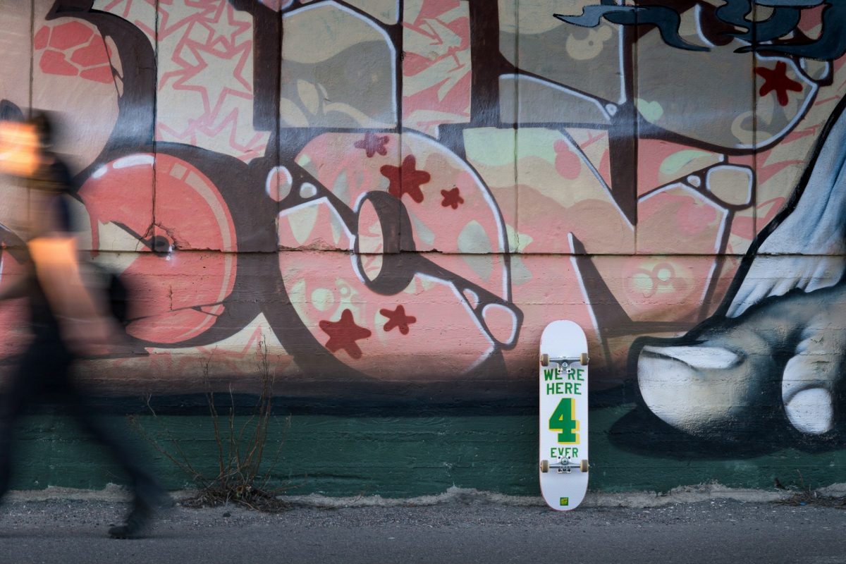 skateboard repurposed as wall art above desk 2.jpg